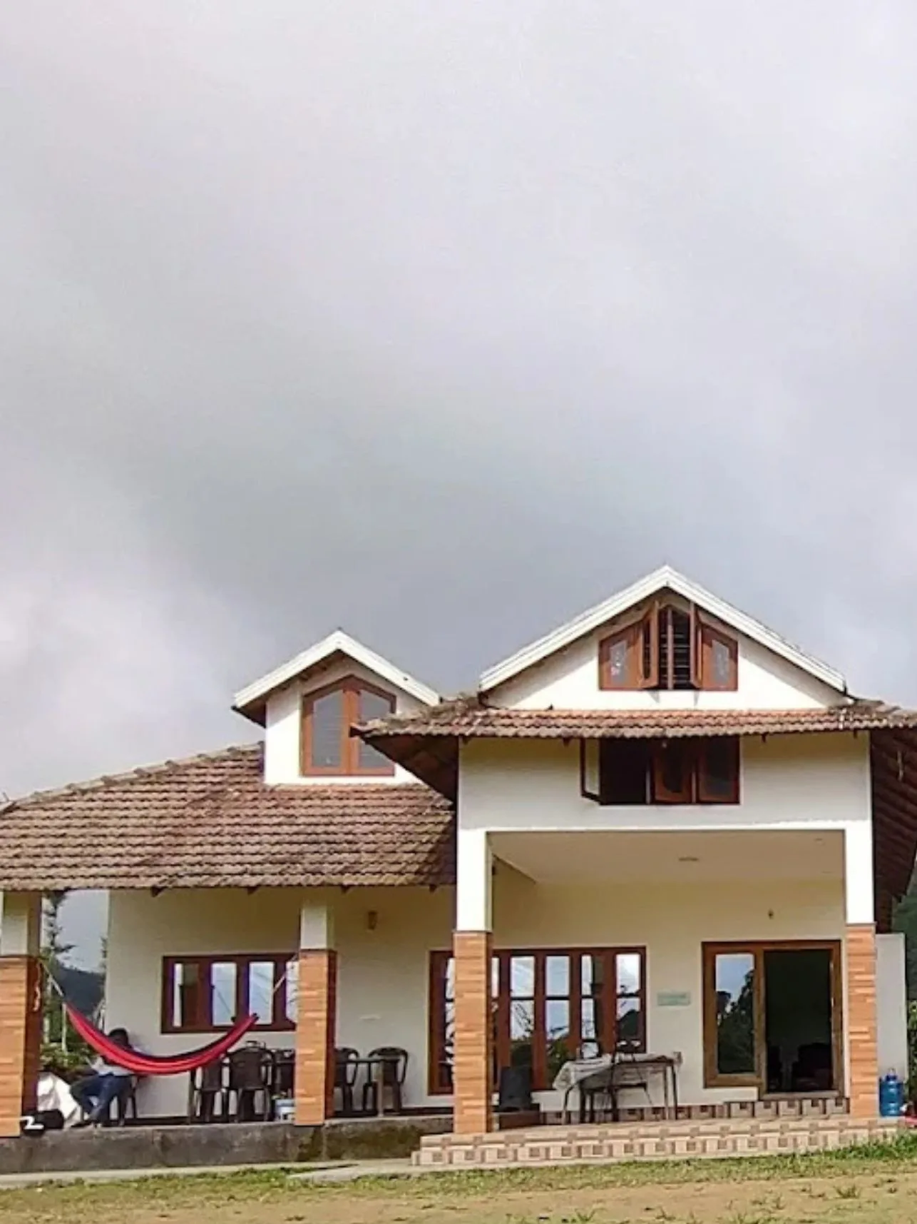 Astagiri homestay building in Chikmagalur with a hammock.