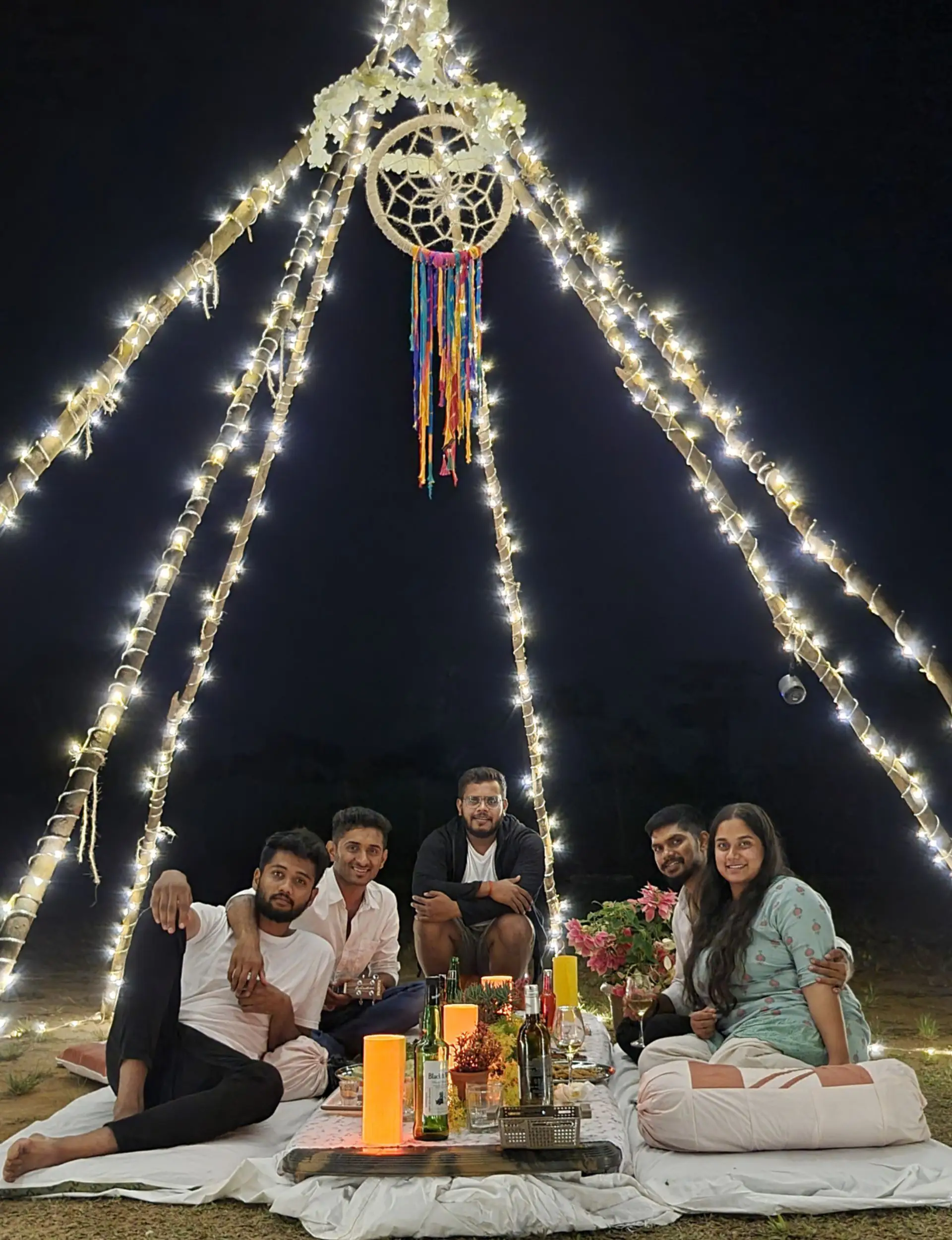 Outdoor dinner experience under lights at Astagiri homestay