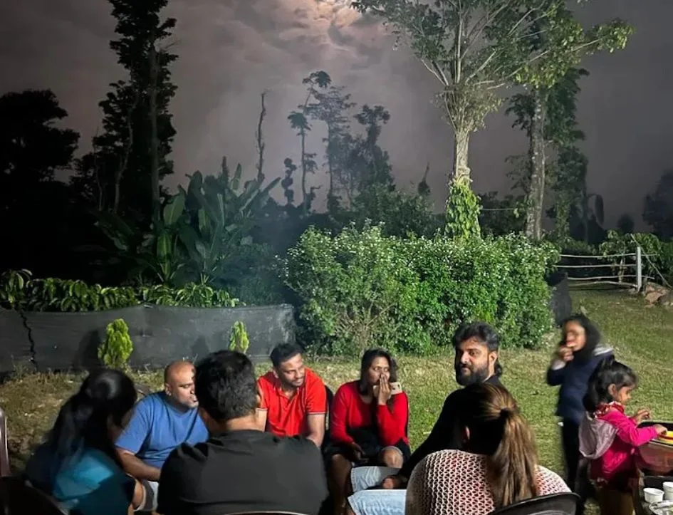 Guests gathered together for an evening at Astagiri homestay in Chikmagalur.