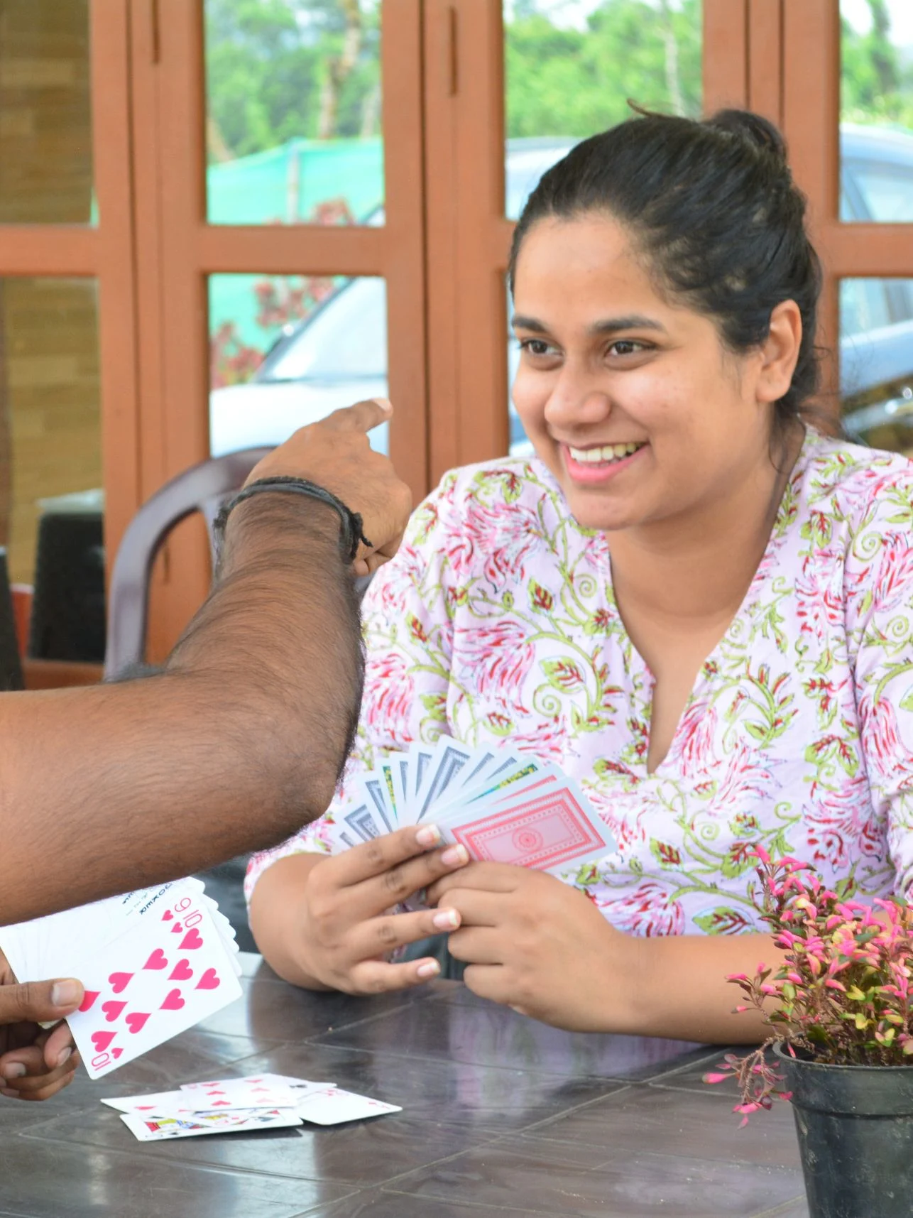 Guests enjoying a card game at Astagiri homestay.