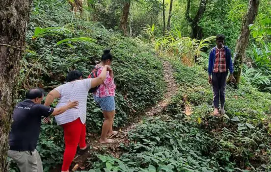 Guests on a forest walk with the hosts at Astagiri.